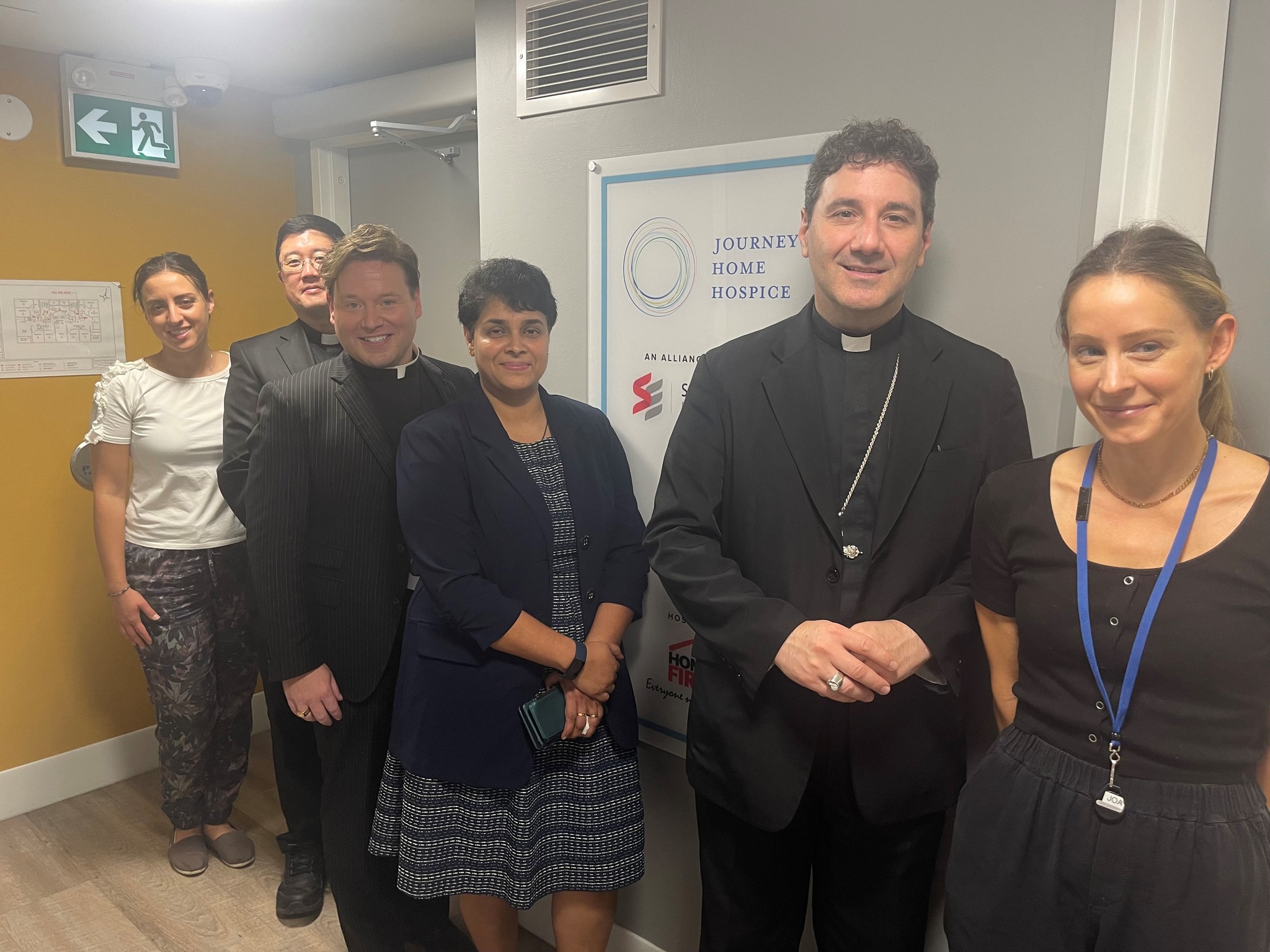 Archbishop Leo and members of Catholic Charities